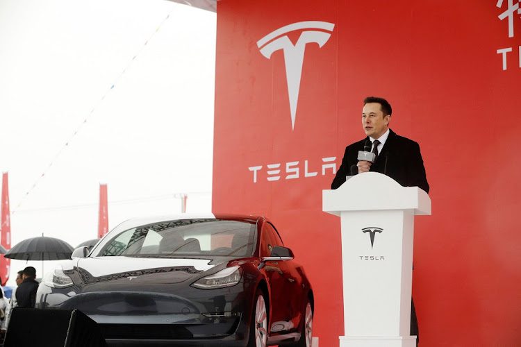 Elon Musk speaking at a Tesla event, following reports he purchased $1bn worth of company shares.